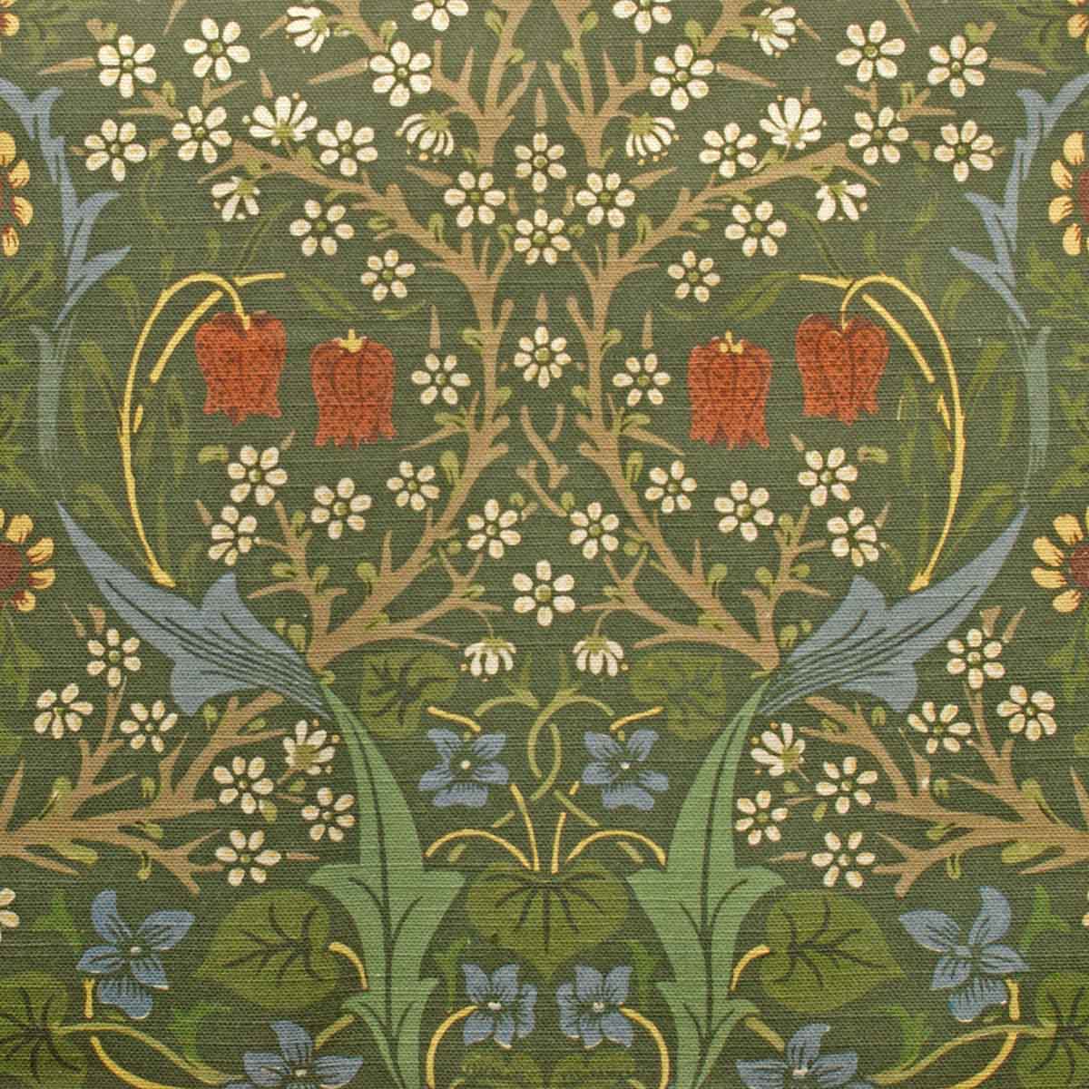 Decorative fabric pattern with red flowers, green leaves, and white flowers on a green background.