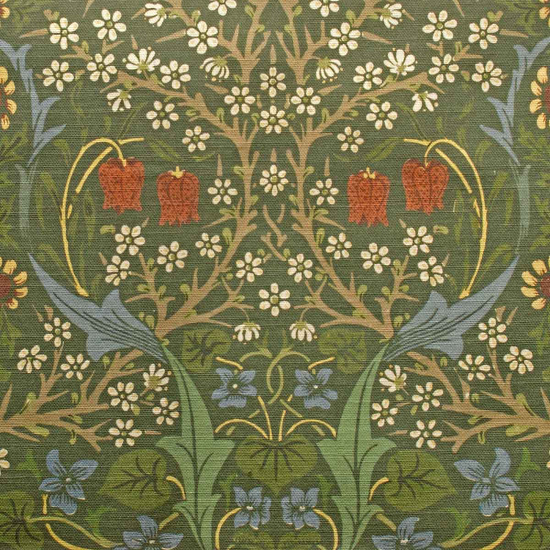 Decorative fabric pattern with red flowers, green leaves, and white flowers on a green background.