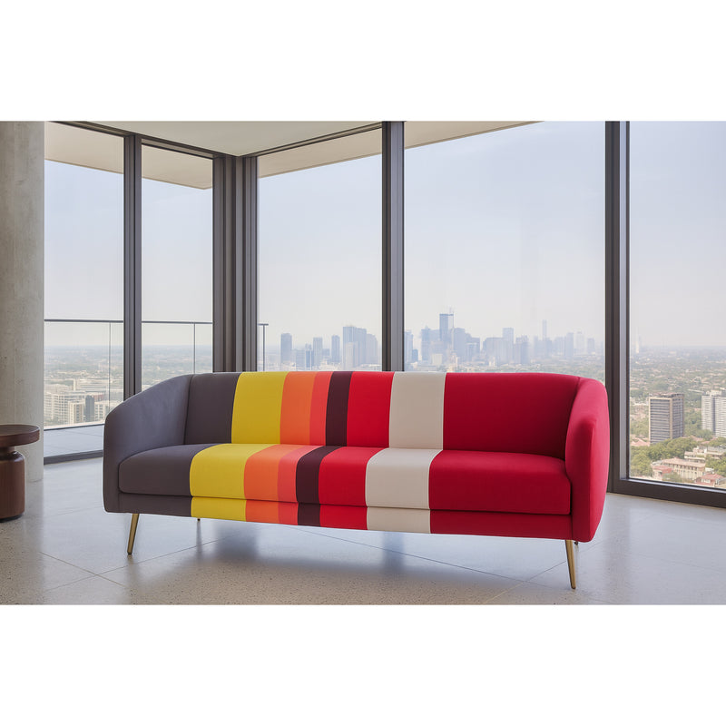 Colorful striped sofa in a modern room with large windows overlooking a cityscape.